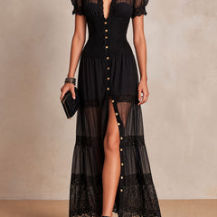 Black maxi dress with V neckline, short puff sleeves, button-front and lace-trim tiers