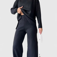 Ribbed knit two-piece set with dark turtleneck top and wide-leg pants