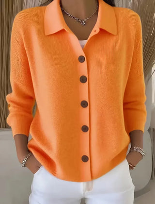 Orange button-front knit cardigan with point collar and dark buttons, long sleeves