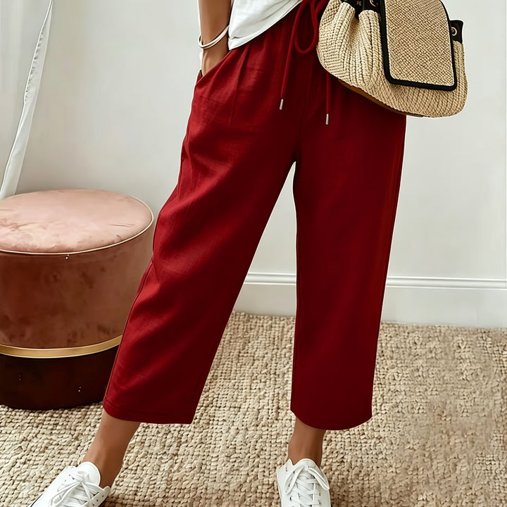 Red cropped wide-leg trousers with drawstring waist and ankle-length hem