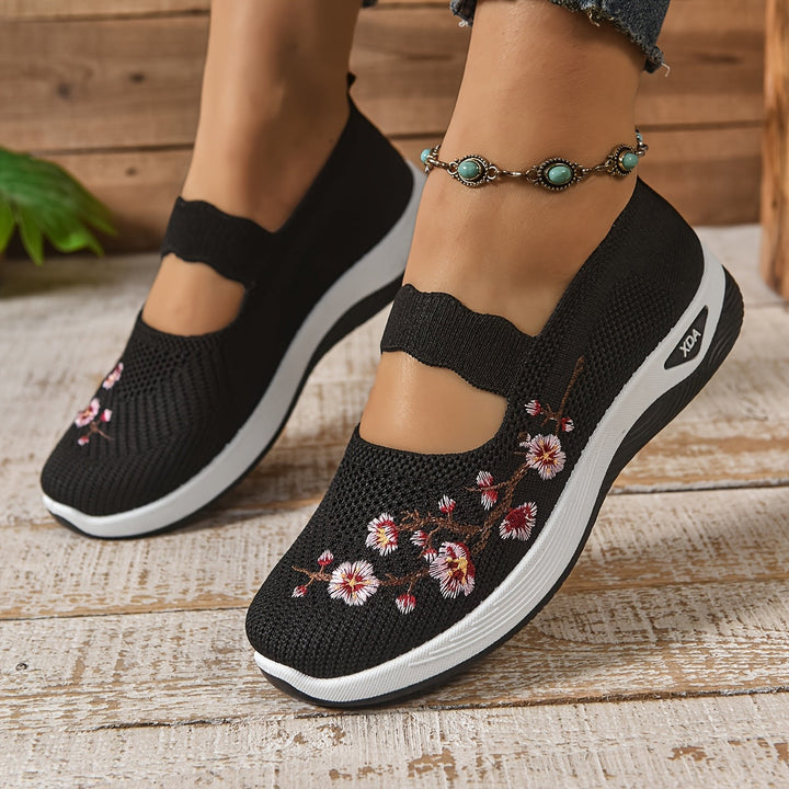 Black knit orthopedic comfort slip-on shoes with floral embroidery and cushioned sole
