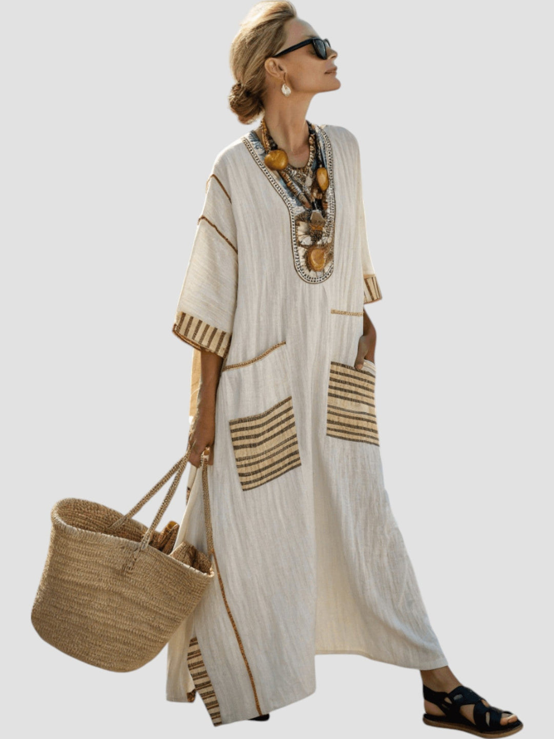 White V-neck midi dress with gold trim stripes, two front pockets, and short sleeves