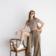 Taupe wide-leg trousers with high waist and front tie belt, loose flowing legs