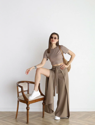 Taupe wide-leg trousers with high waist and front tie belt, loose flowing legs