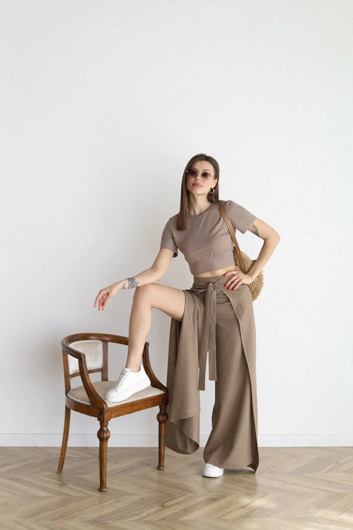 Taupe wide-leg trousers with high waist and front tie belt, loose flowing legs