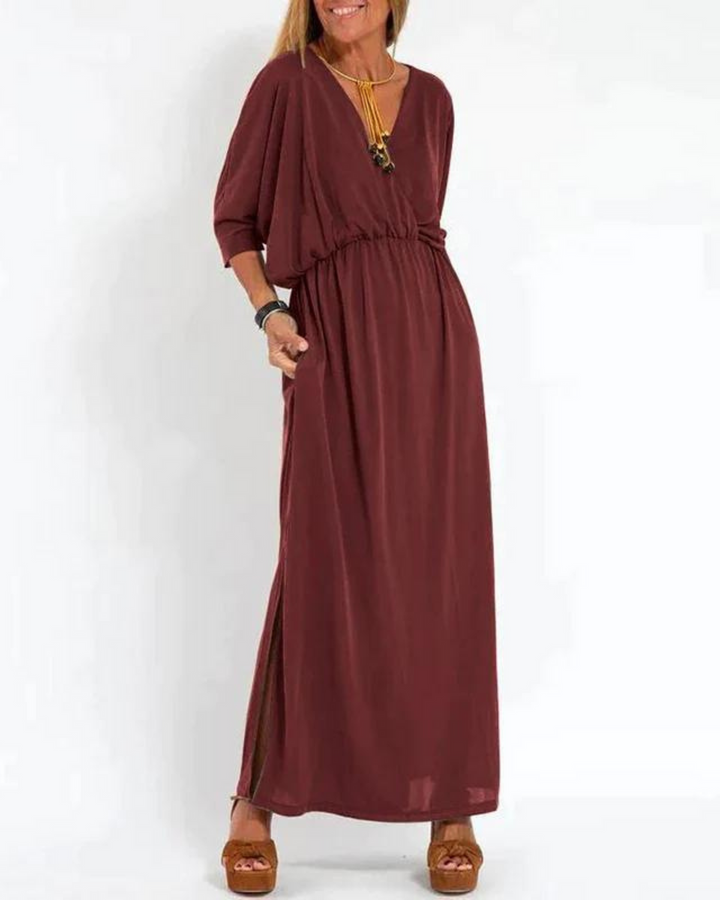 Burgundy bohemian summer dress with V-neck, elastic waist, and flowy maxi skirt