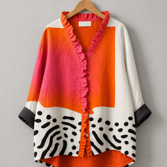 Relaxed tunic on hanger, ruffle button-front with orange and white color-block and zebra print