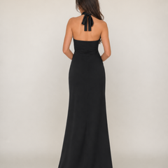 Black sleeveless halter-back maxi dress with tie detail and floor-length skirt