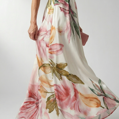 Halter floral maxi dress with wide skirt; cream base with pink flowers and green leaves