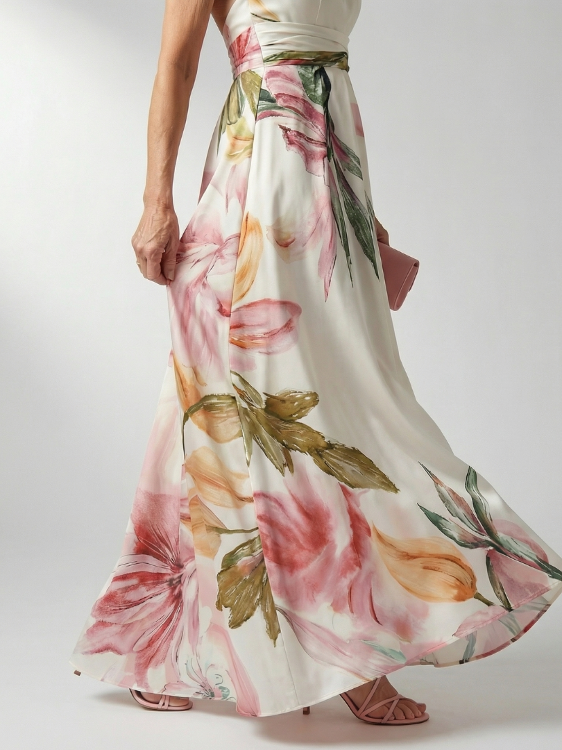 Halter floral maxi dress with wide skirt; cream base with pink flowers and green leaves