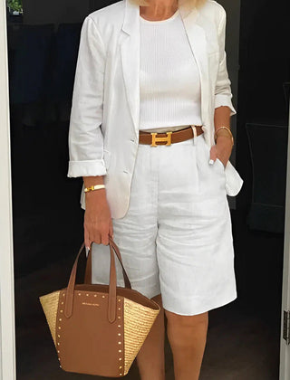 White two-piece suit set with cropped blazer and matching shorts