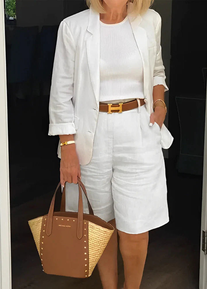White two-piece suit set with cropped blazer and matching shorts