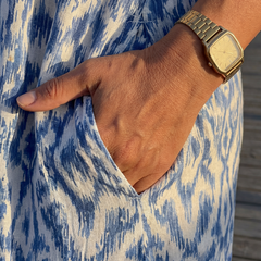 Blue and cream patterned dress fabric with V-neckline and short sleeve cuff