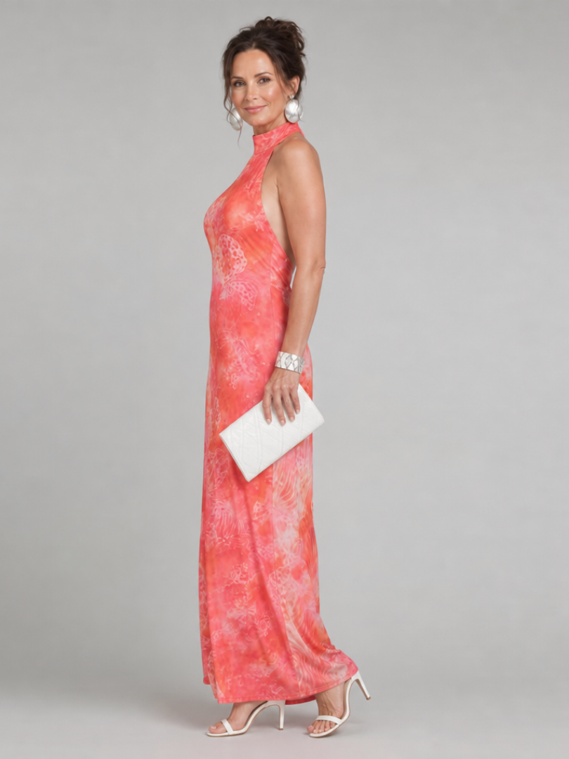 Orange halter neck maxi dress with pink abstract patterned print, sleeveless