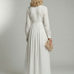 White soft flow maxi dress back view with long sleeves and gathered waist