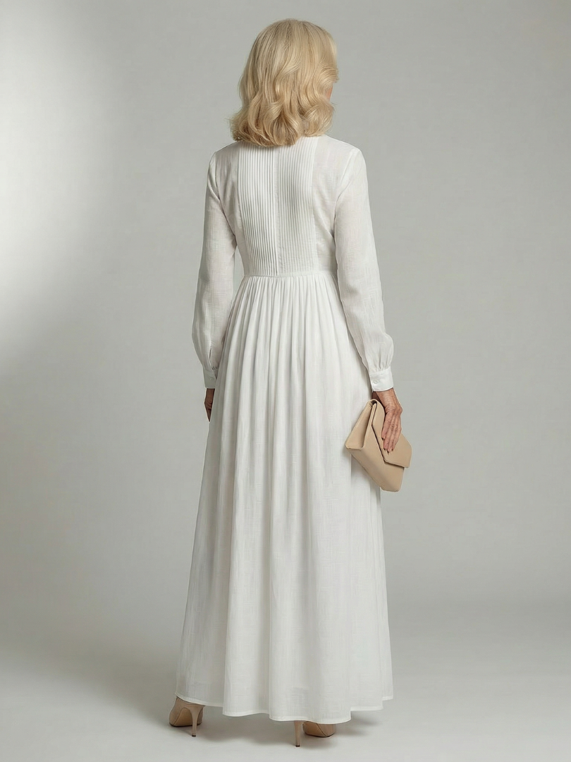 White soft flow maxi dress back view with long sleeves and gathered waist