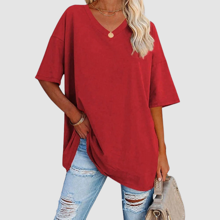 Red V-neck T-shirt with short sleeves, relaxed fit, draped side hem slit.