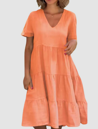 Orange V-neck short-sleeve soft dress with layered tiered skirt and loose A-line shape