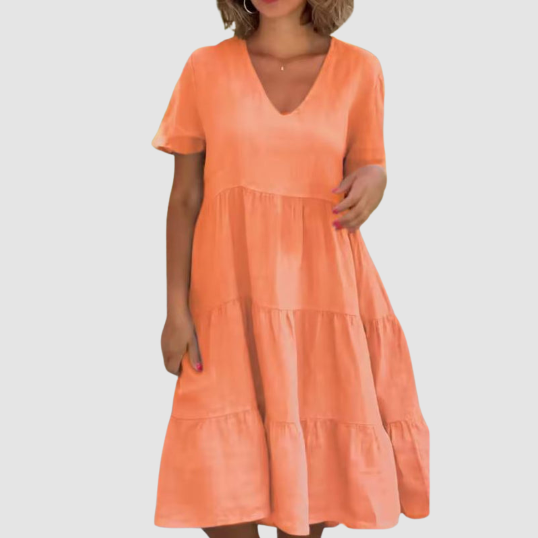 Orange V-neck short-sleeve soft dress with layered tiered skirt and loose A-line shape