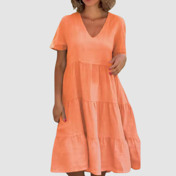 Orange V-neck short-sleeve soft dress with layered tiered skirt and loose A-line shape