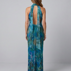 Back view of blue printed keyhole halter maxi dress with open tie strap