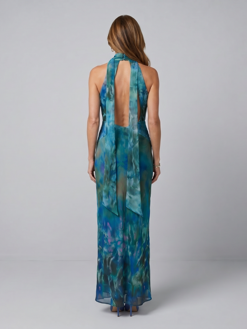 Back view of blue printed keyhole halter maxi dress with open tie strap