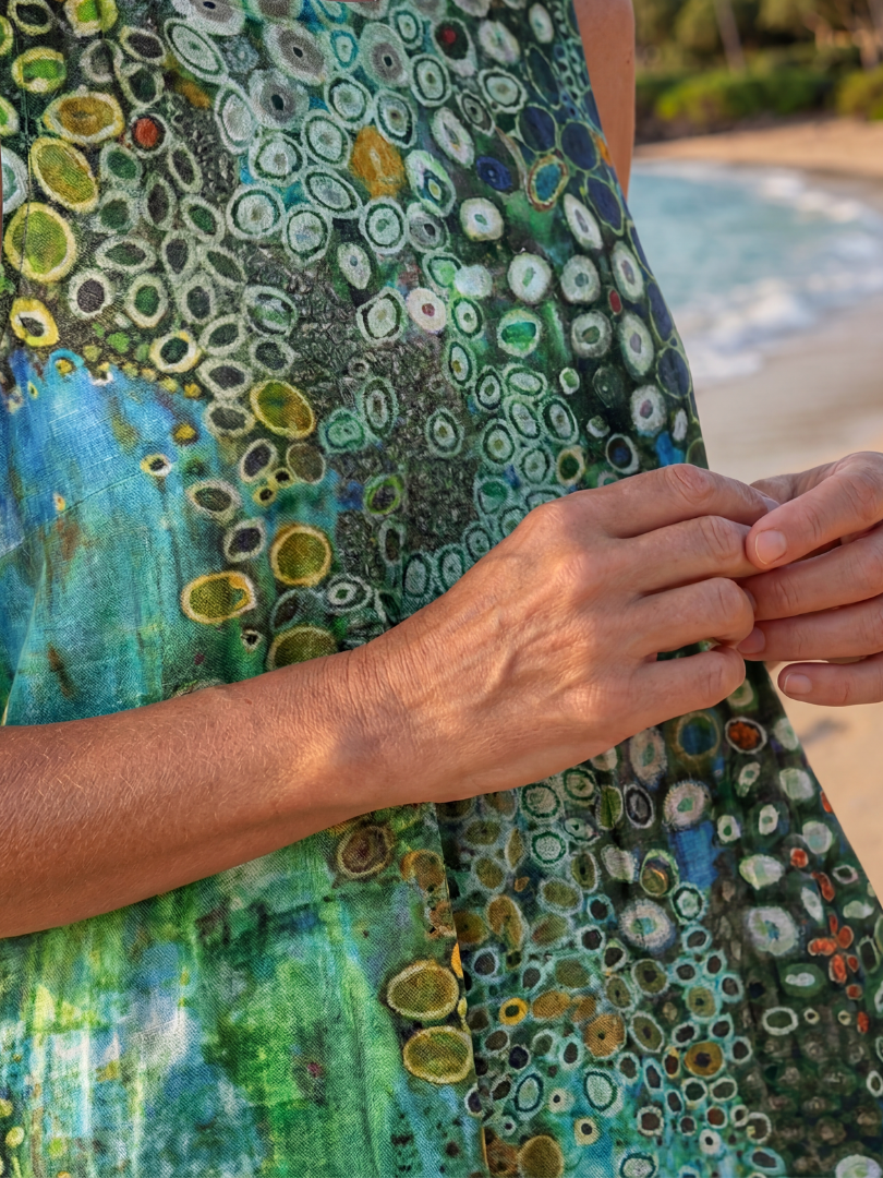 Ocean mosaic dress fabric detail, green and blue with circular multicolor print