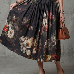 Black floral pleated midi skirt with gathered waist and sleeveless bodice