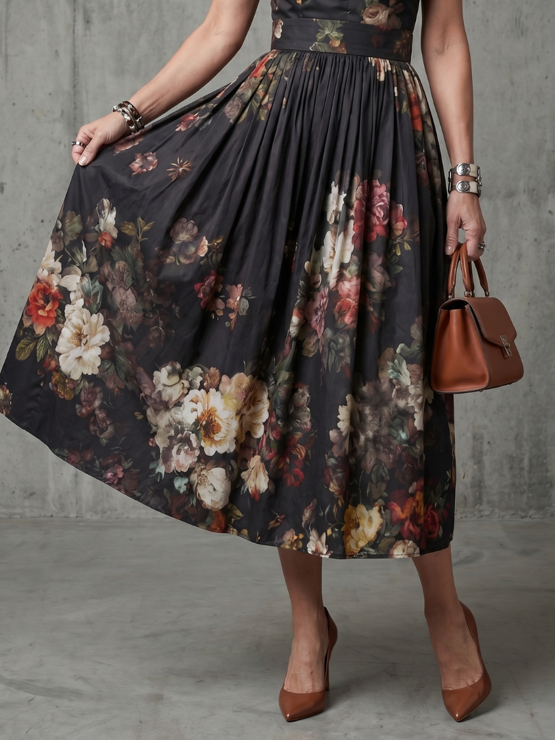 Black floral pleated midi skirt with gathered waist and sleeveless bodice