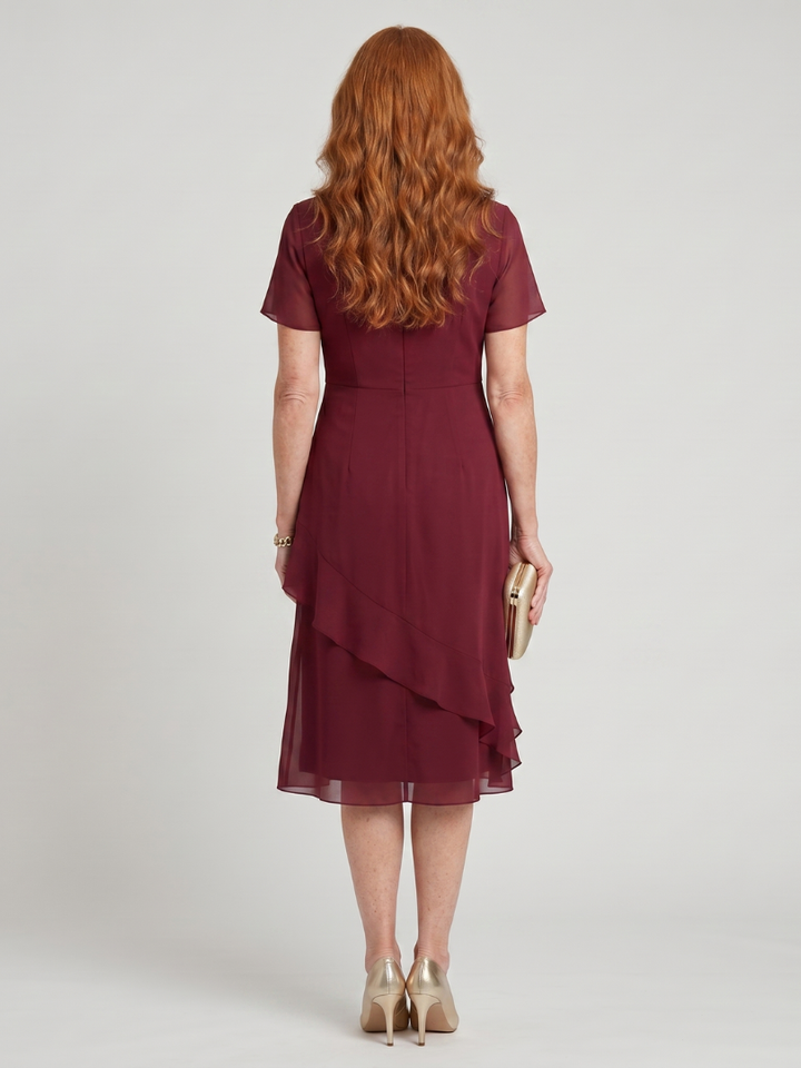 Burgundy midi dress with short sleeves and layered ruffle hem, back view