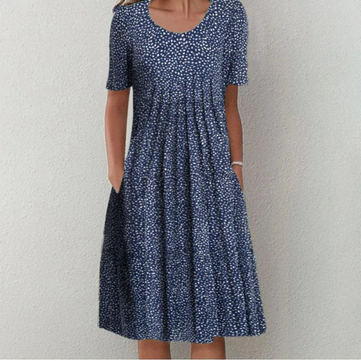 Navy dotted dress with scoop neck, short sleeves, gathered A-line skirt