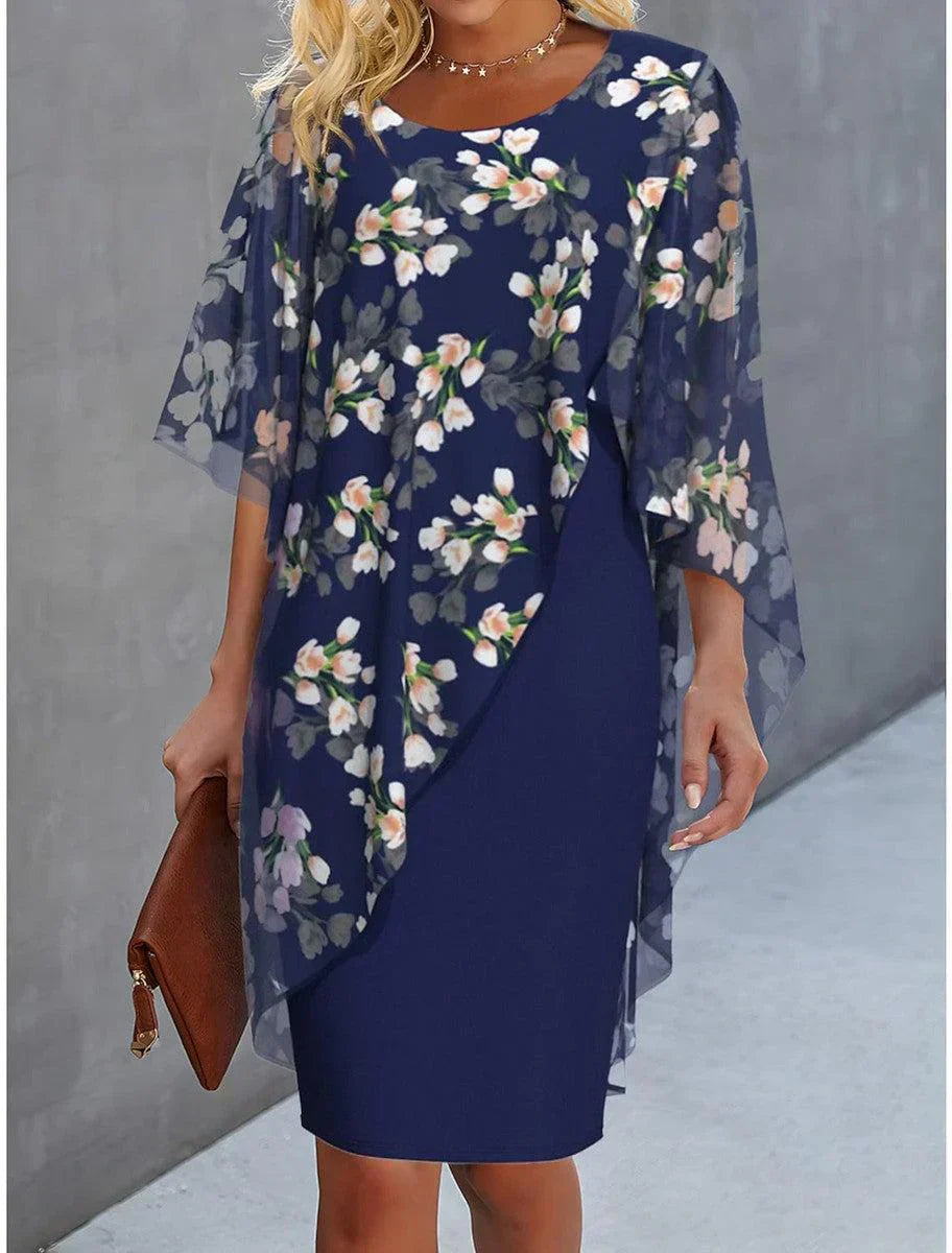 Floral cape dress in dark navy with sheer cape sleeves and straight sheath silhouette