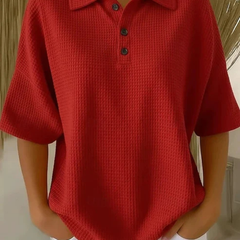 Red waffle knit polo blouse with short sleeves, pointed collar, three-button placket