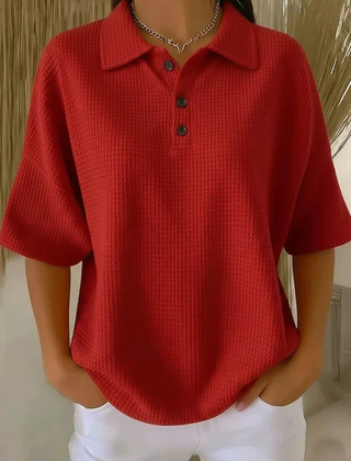 Red waffle knit polo blouse with short sleeves, pointed collar, three-button placket