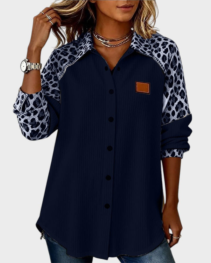 Leopard-print yoke button-down shirt with dark navy striped body and square chest patch