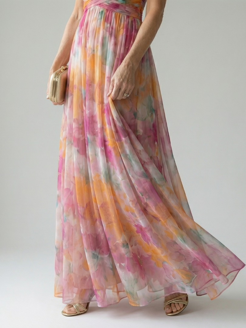 Soft wrap maxi dress hem and side drape in pink, orange, and greenish watercolor tones