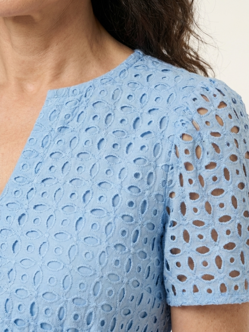 Sky blue eyelet short-sleeve dress detail with openwork cutouts on the shoulder