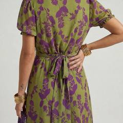 Olive and purple floral midi dress with low scoop back, tie waist, and puff sleeves