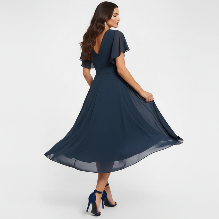Flowing V-neck maxi dress in dark navy with short flutter sleeves and cinched waist