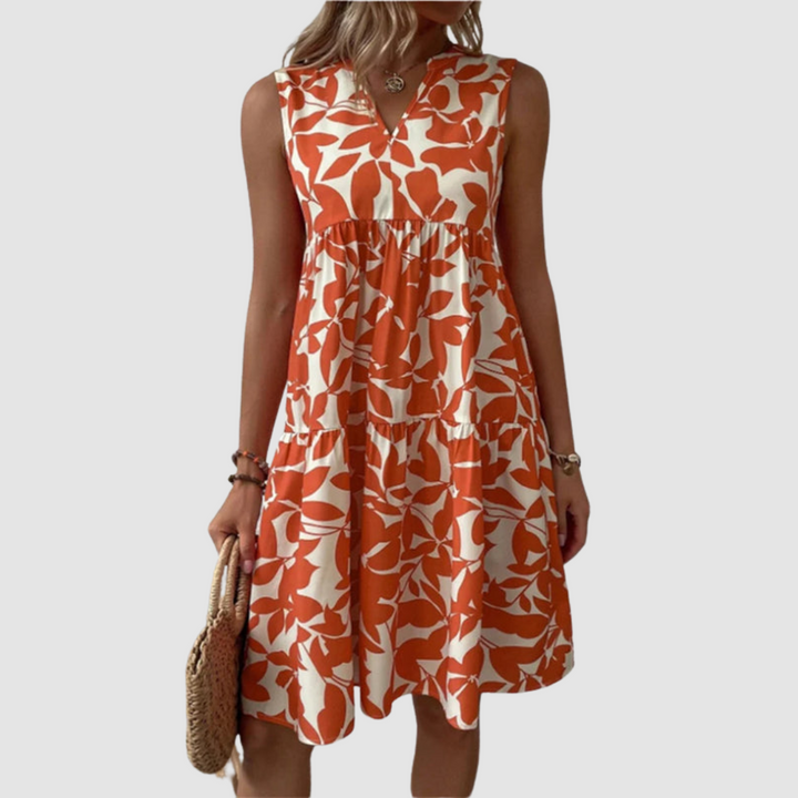 Red sleeveless V-neck flowy dress with leaf-pattern print and gathered skirt
