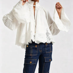 Vivienne blouse in white with front keyhole opening, embroidered lace hem, puff sleeves