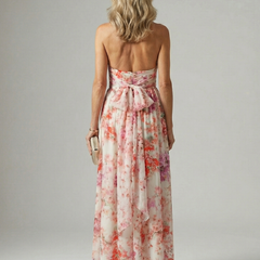 Elyon floral maxi dress back view with open halter-style tie and flowing full skirt