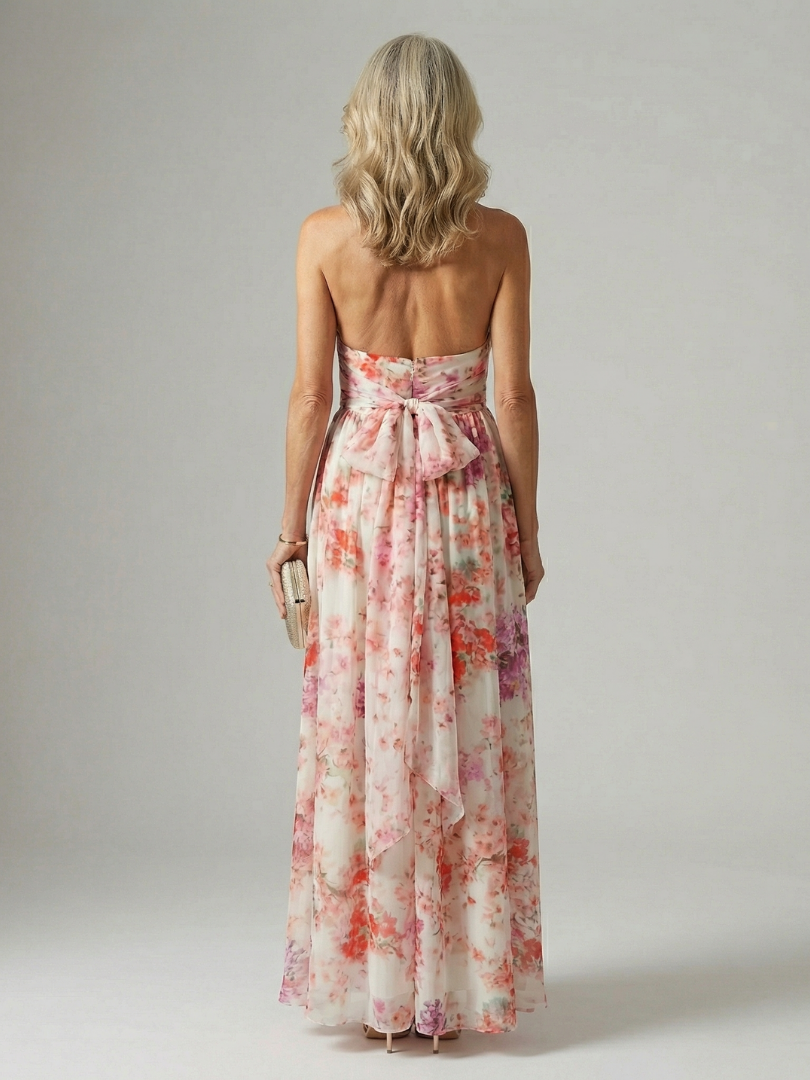 Elyon floral maxi dress back view with open halter-style tie and flowing full skirt