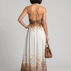 Pleated halter midi dress back view in white with brown leopard-print hem
