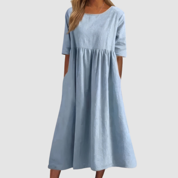 Sky blue breezy dress with gathered waist and short sleeves, knee-length A-line silhouette