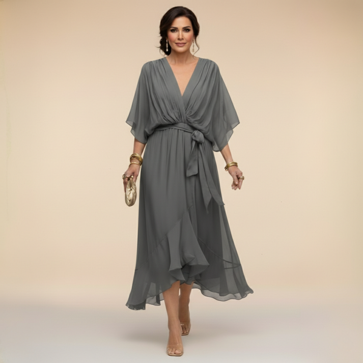 Charcoal gray V-neck wrap dress with tied waist and floating chiffon hem