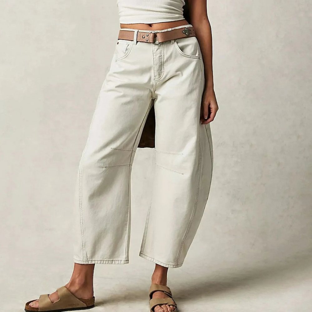 Cream wide-leg jeans with belt loops, button closure, and front patch pockets.