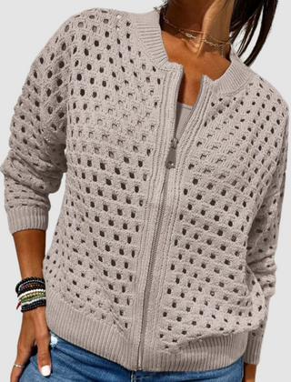 Light beige full-zip knitted cardigan with perforated dot pattern and ribbed cuffs