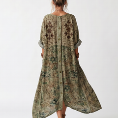 Green patterned oversized midi dress, back view with button placket and flowing asym hem