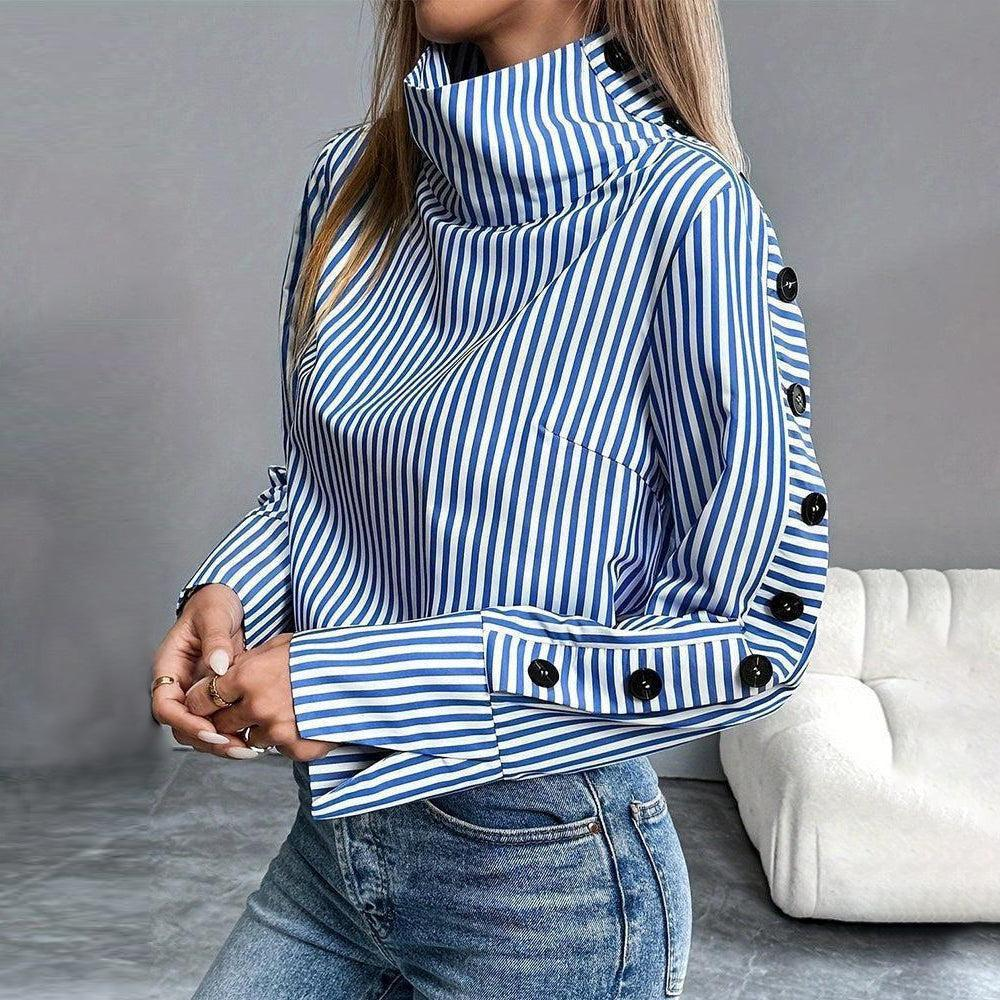 Blue-and-white striped high-neck top with button cuffs and tall collar detail.